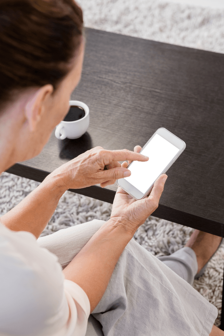 Transparent Smartphone Use with Coffee Cup in Background