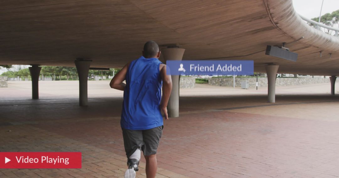 Athlete with Prosthetic Leg Running Under Overpass