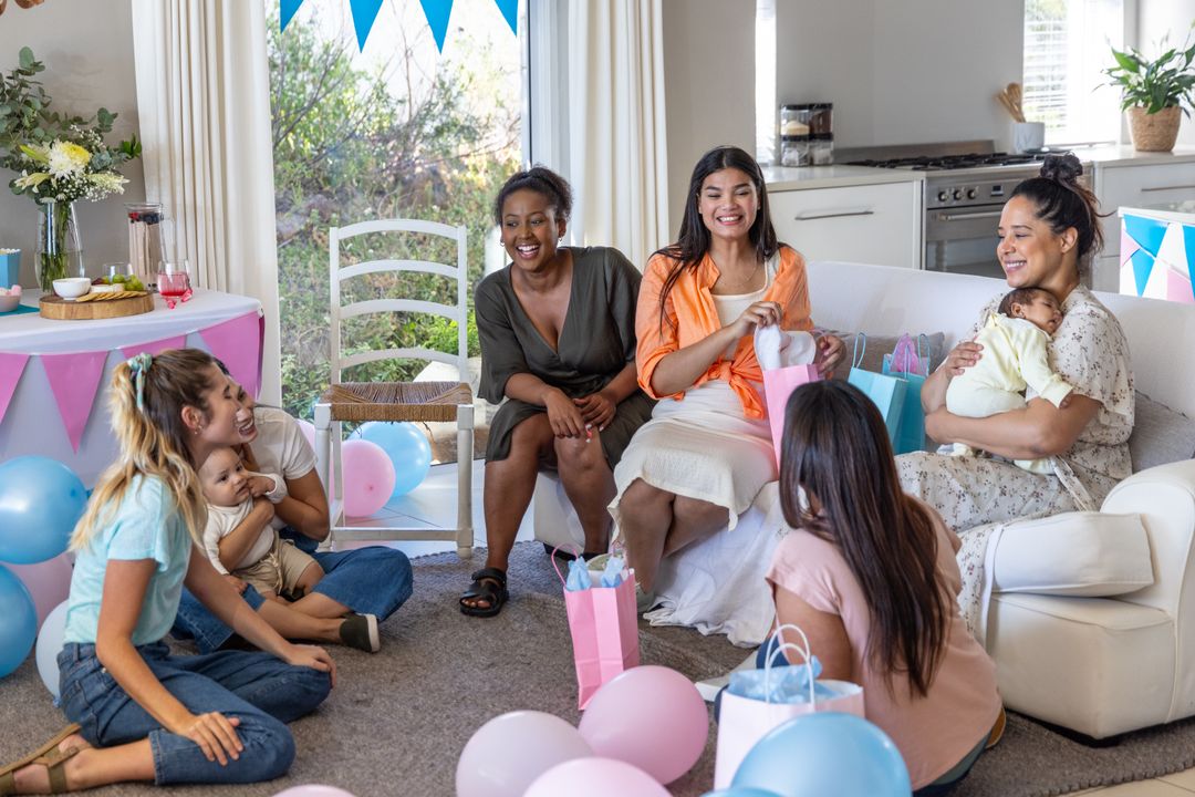 Diverse Mothers Unwrapping Gifts with Babies at Joyful Gathering
