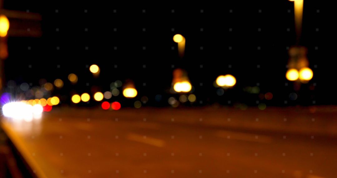 Blurred Urban Night Scene with Warm Streetlights
