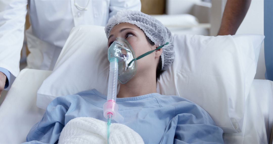 Patient Receiving Oxygen Therapy in Hospital Bed - Free Images, Stock Photos and Pictures on Pikwizard.com