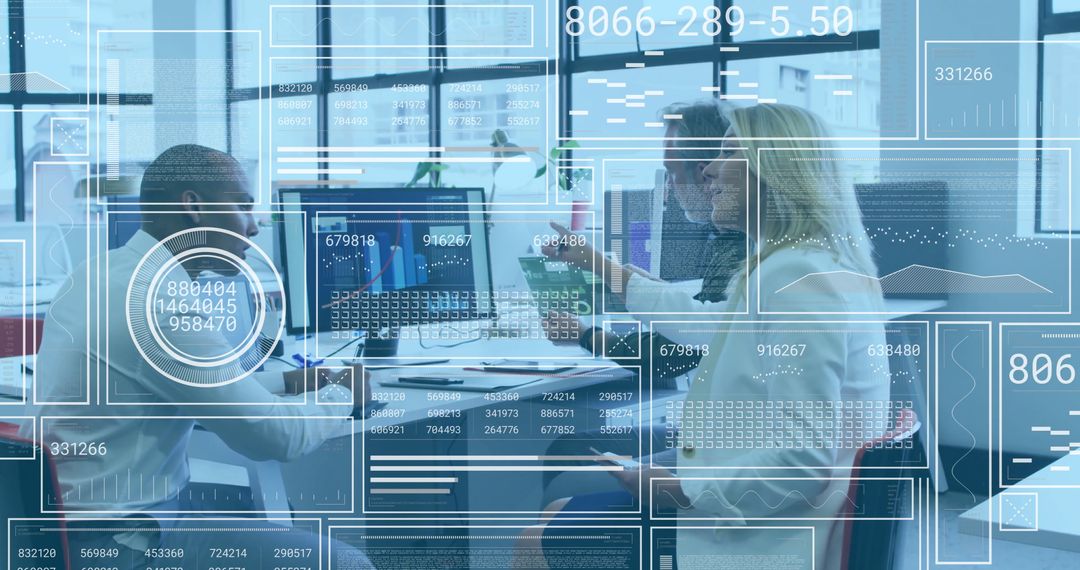 Business Team Analyzing Data on Dual Monitors in Modern Office Environment