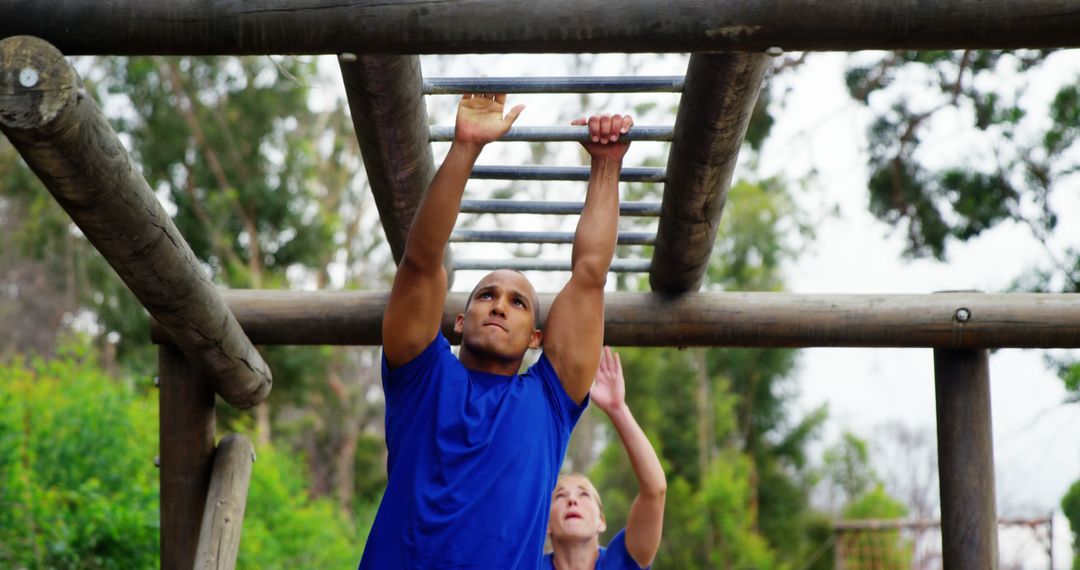 People Exercising on Monkey Bars in Outdoor Fitness Park - Free Images, Stock Photos and Pictures on Pikwizard.com