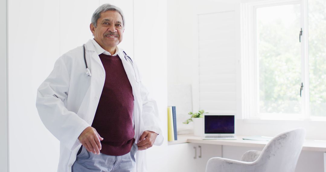 Smiling Senior Doctor in Office with Stethoscope - Free Images, Stock Photos and Pictures on Pikwizard.com