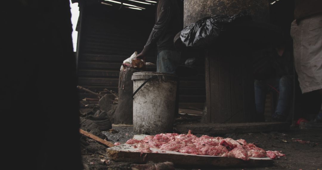 Meat Processing in Rural Setting with Dark Moody Lighting - Free Images, Stock Photos and Pictures on Pikwizard.com