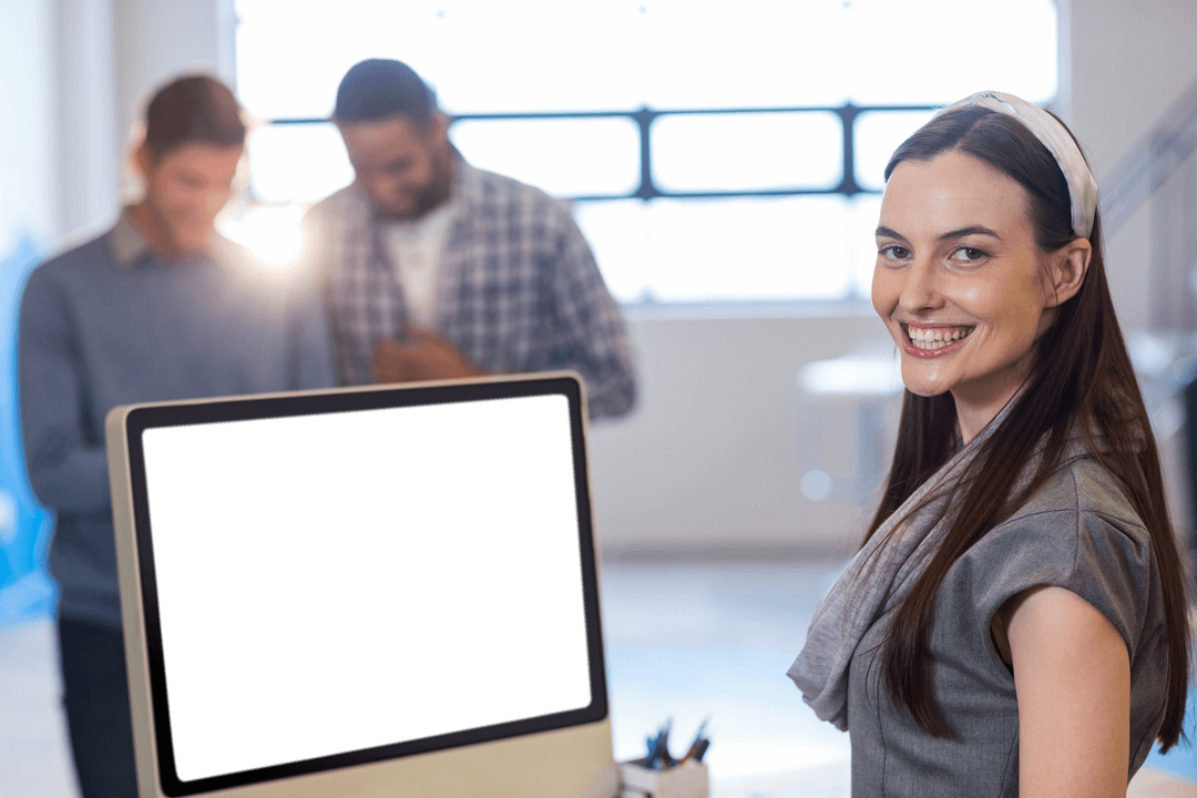 Cheerful Businesswoman in Office with Transparent Computer Screen