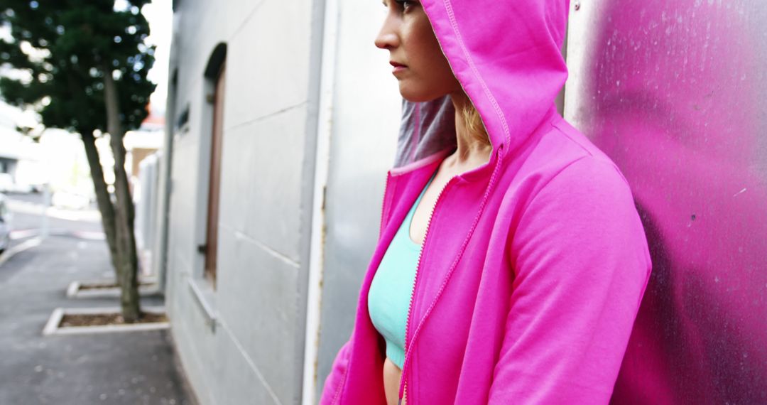 Young Woman in Pink Hoodie Standing Outdoors - Free Images, Stock Photos and Pictures on Pikwizard.com