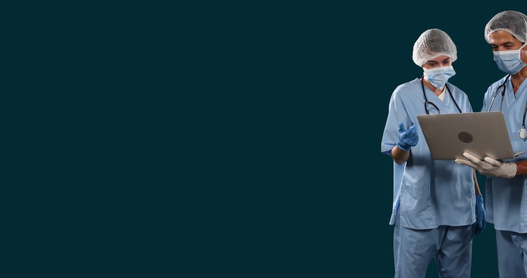 Doctors Collaborating on Patient Reports Using Laptop Technology