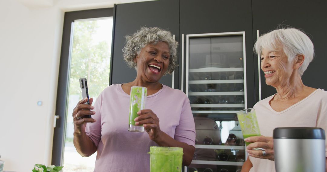 Senior Friends Enjoying Green Smoothies in Modern Kitchen - Free Images, Stock Photos and Pictures on Pikwizard.com
