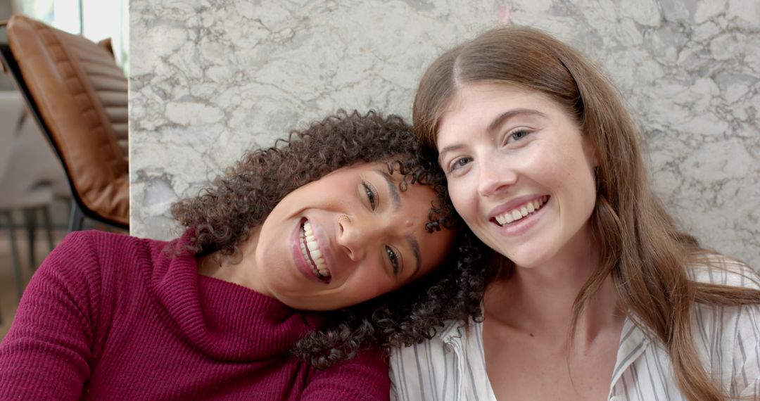 Smiling Diverse Friends Relaxing Indoors