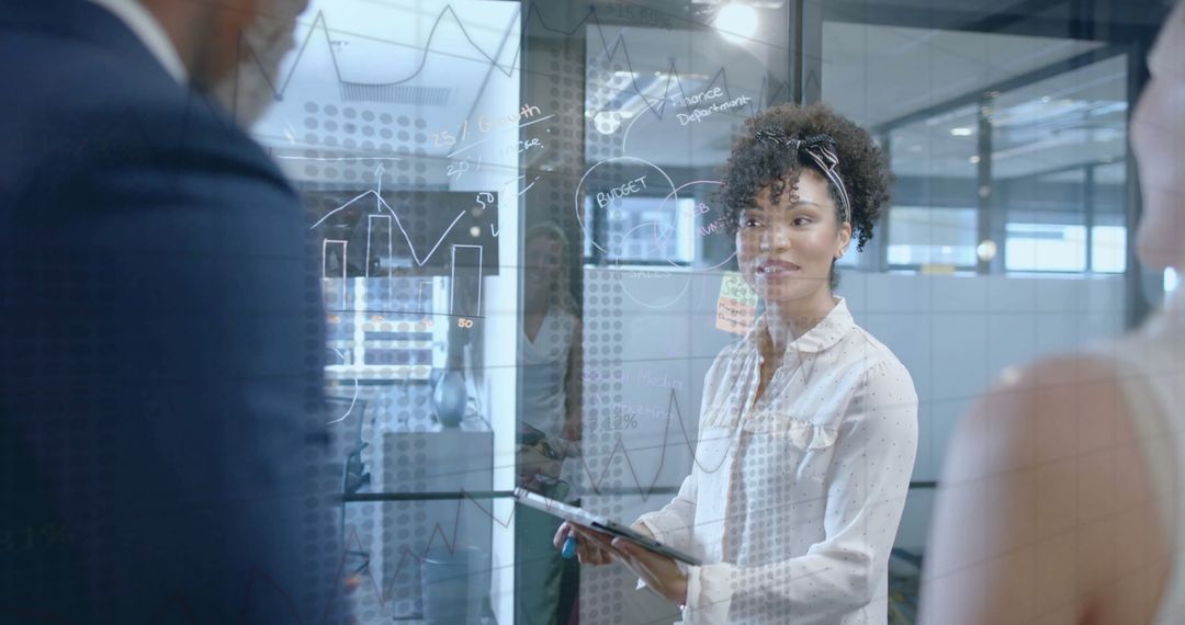 Business Team Analyzing Financial Graphs for Strategy Planning