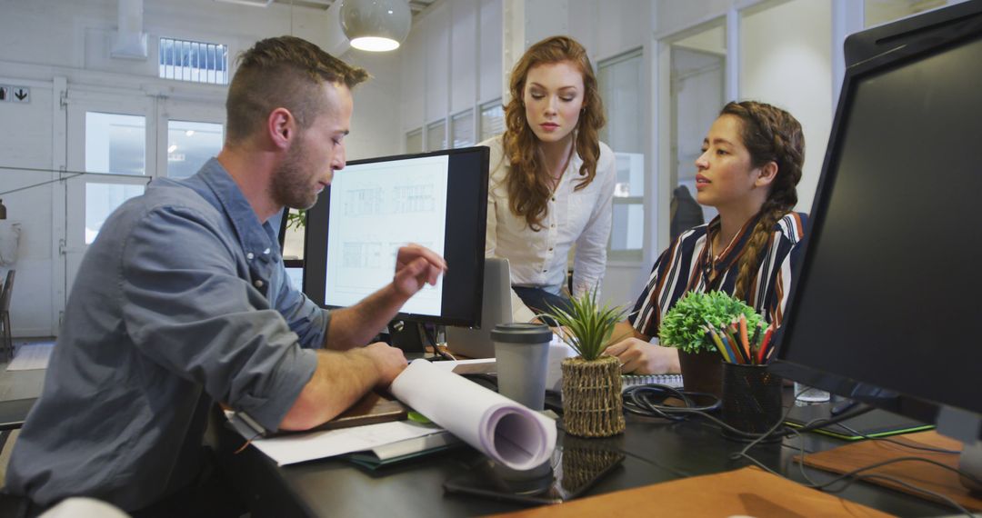 Modern Office Team Collaborating on Project with Digital Devices