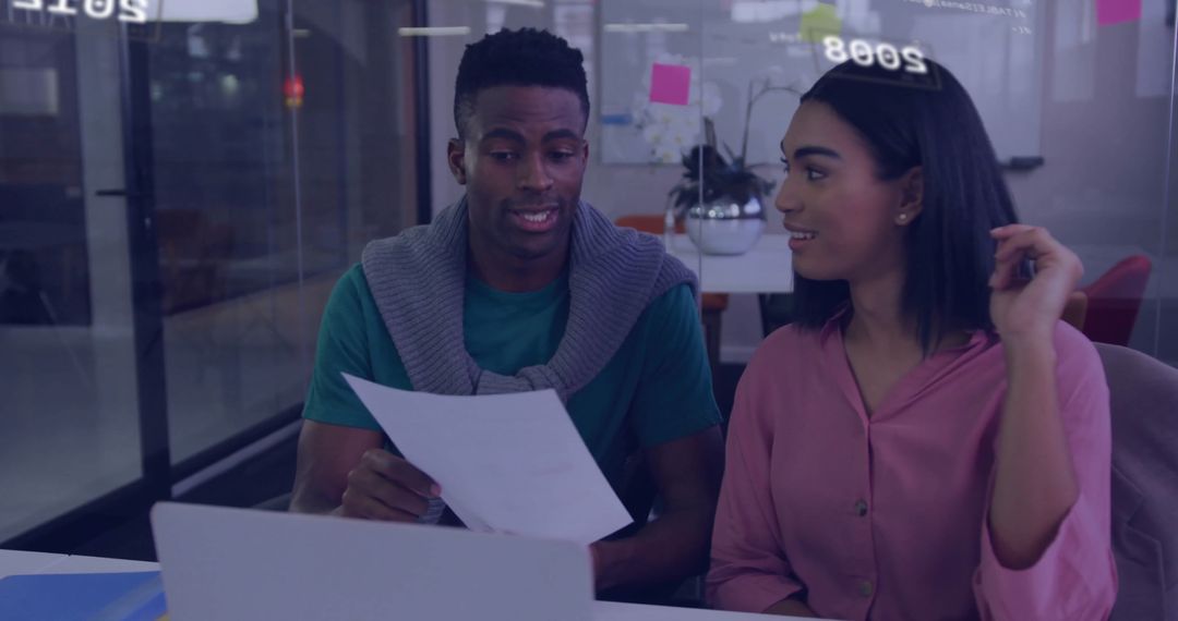 Collaborating Business Professionals Discussing Project at Office