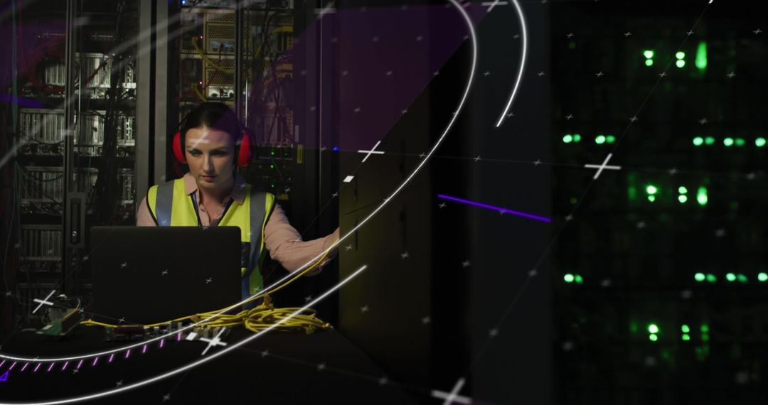 IT Engineer Managing Data Center Server with Laptop and Headset