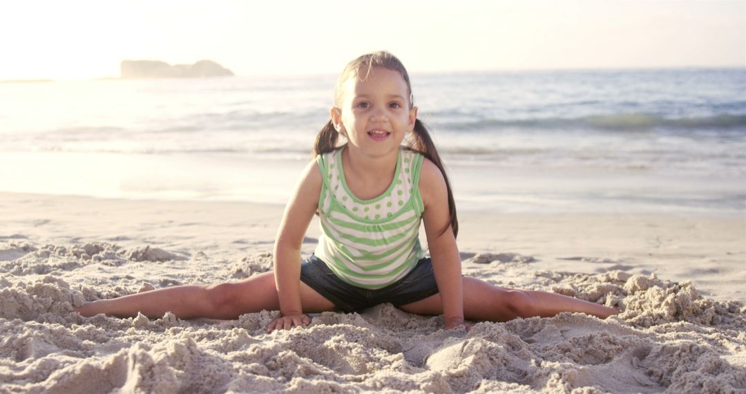 Young Girl Doing Splits on Beach at Sunset - Free Images, Stock Photos and Pictures on Pikwizard.com