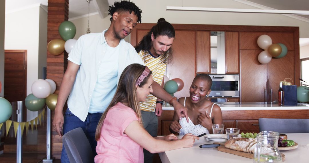 Diverse Friends Sharing Laughter at Home Dining Table
