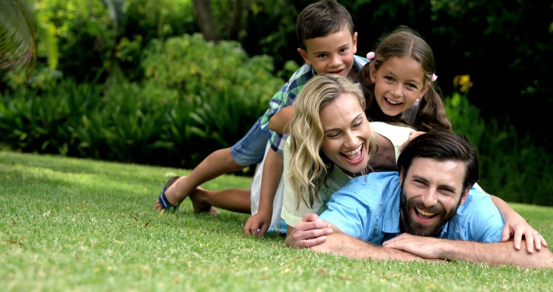 Happy Family Bonding Outdoors on Grass - Free Images, Stock Photos and Pictures on Pikwizard.com