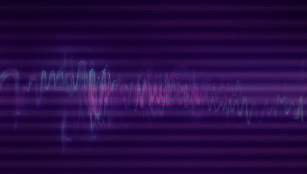 Futuristic Neon Audio Waveform Display on Retro Screen