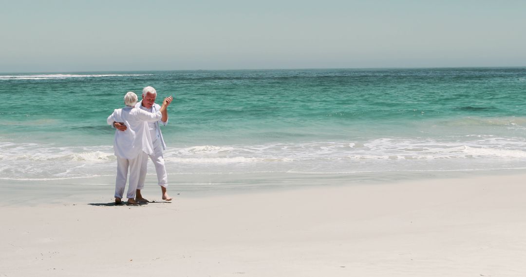 Senior Couple Enjoying a Romantic Walk on Beach - Free Images, Stock Photos and Pictures on Pikwizard.com