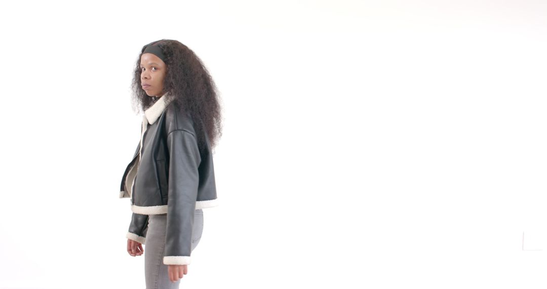 Confident Woman in Stylish Leather Jacket Against White Background