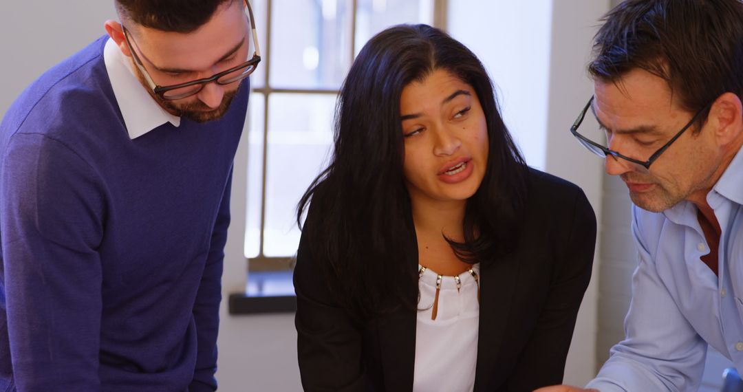 Diverse Team Collaborating on Business Project in Office Setting