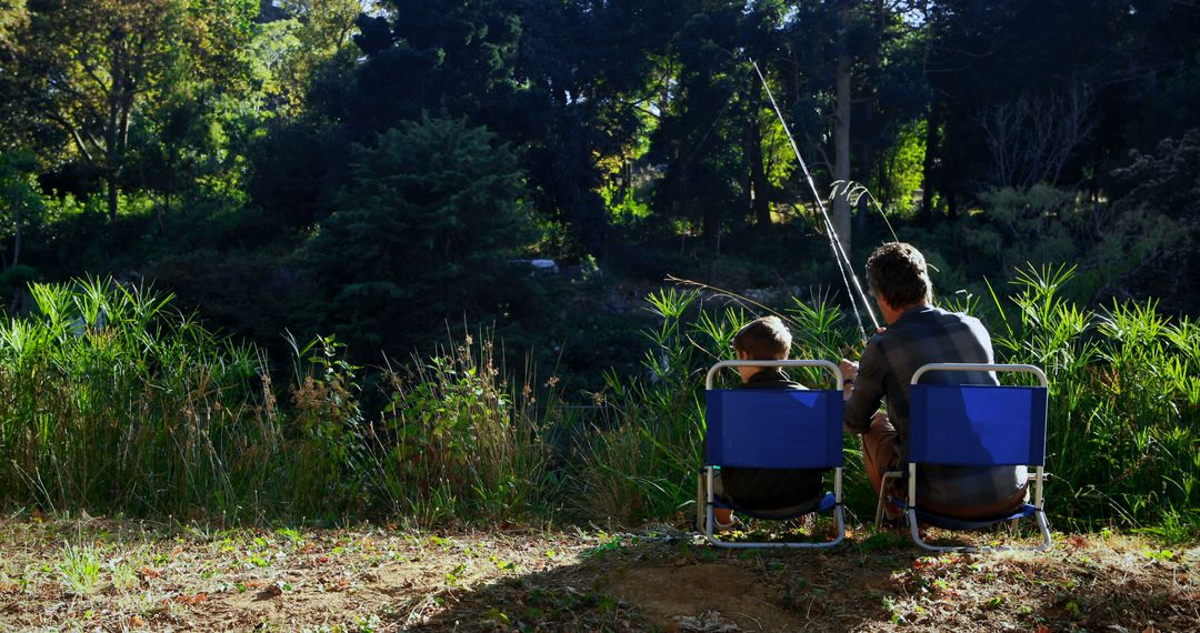 Father and Son Fishing Together in Serene Forest - Free Images, Stock Photos and Pictures on Pikwizard.com