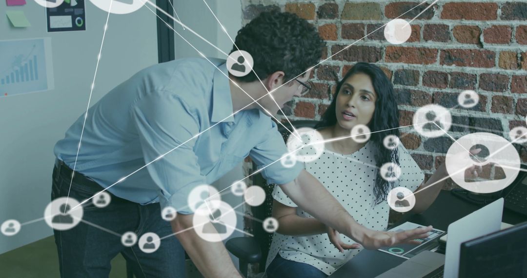 Diverse Colleagues Collaborating on Networking Project in Modern Office