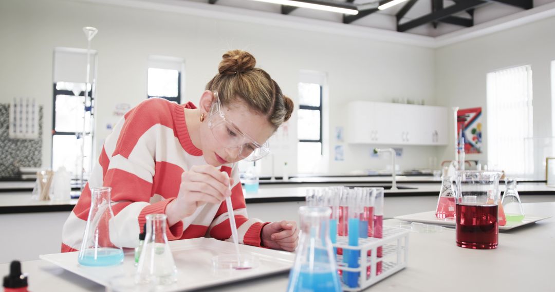 Young Student Conducting Scientific Experiment in Laboratory
