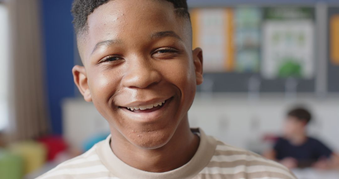 Happy School Boy Smiling in Classroom Environment