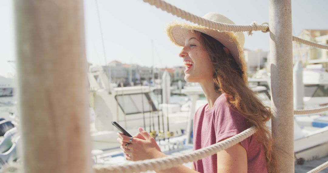 Smiling Teenage Girl Using Smartphone by Marina on Sunny Day - Free Images, Stock Photos and Pictures on Pikwizard.com