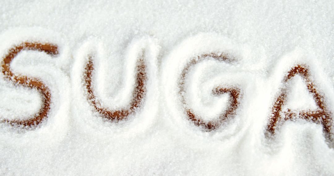 Sugar is written in granulated white sugar, with copy space - Free Images, Stock Photos and Pictures on Pikwizard.com