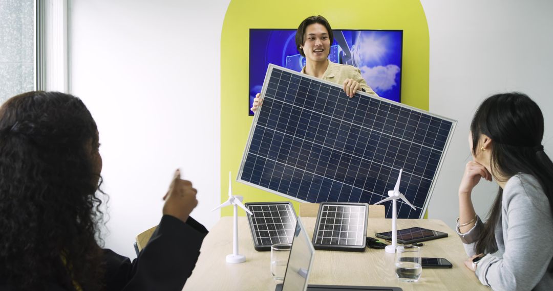 Diverse coworkers discussing sustainable energy solutions in modern office