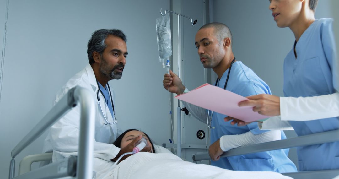 Medical Team Treating Patient in Hospital Bed with Care and Precision - Free Images, Stock Photos and Pictures on Pikwizard.com