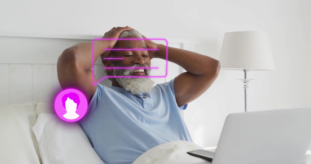 Senior Man Using Laptop with Augmented Reality in Bedroom