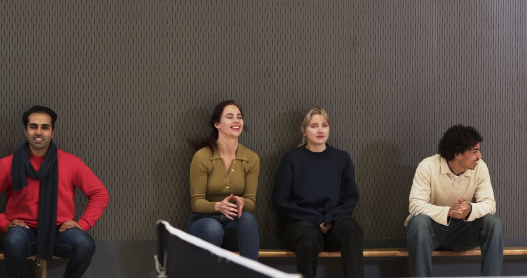 Diverse Friends Relaxing and Structured in Sports Hall
