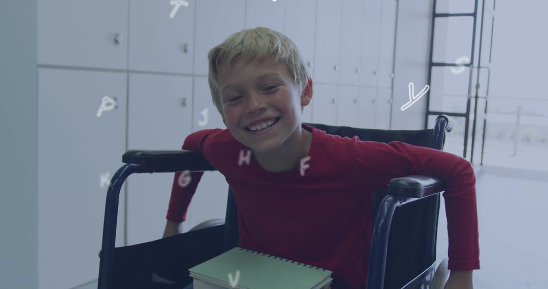 Smiling Schoolboy in Wheelchair with Floating Letters in Classroom