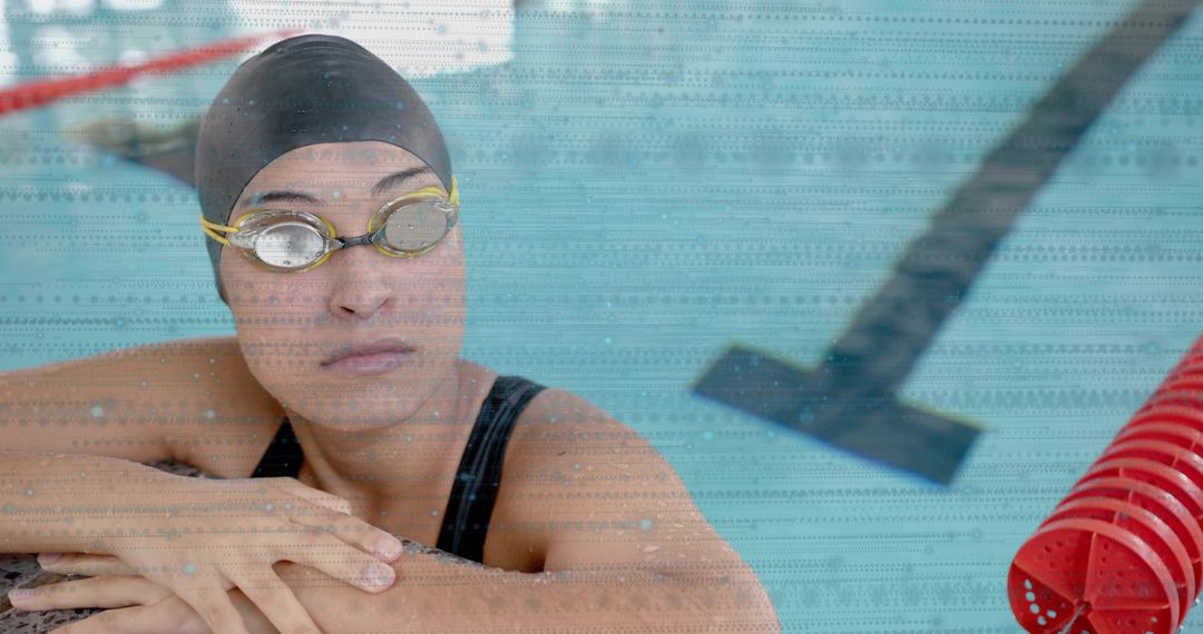 Athletic Female Swimmer Resting in Indoor Pool After Training