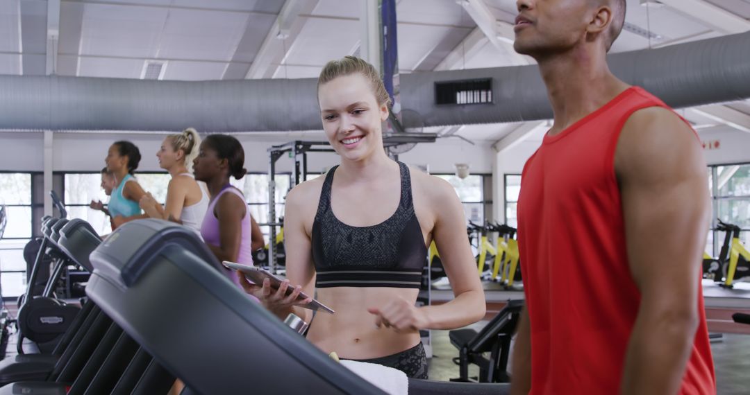 Individuals Exercising on Treadmills in Modern Gym - Free Images, Stock Photos and Pictures on Pikwizard.com