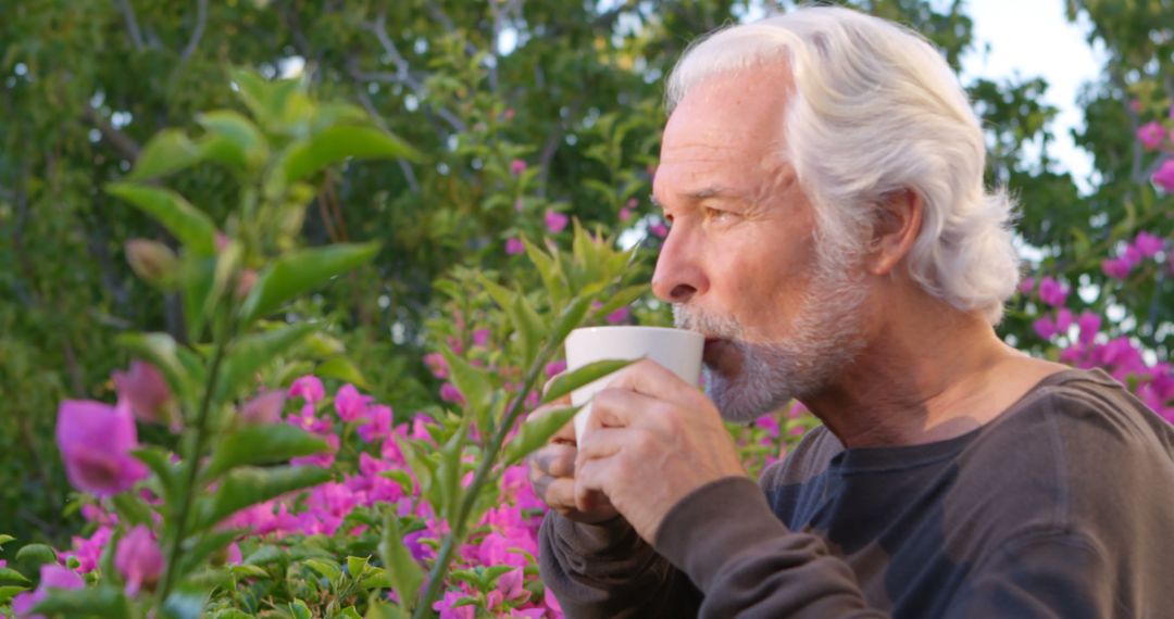 Senior Man Enjoying Coffee in Garden with Flowers - Free Images, Stock Photos and Pictures on Pikwizard.com