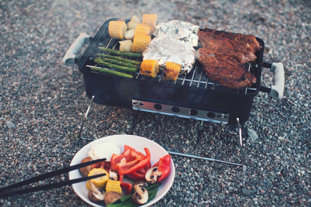 Grilling Steak and Veggies on Portable Charcoal Grill for Camping Picnic Cookout