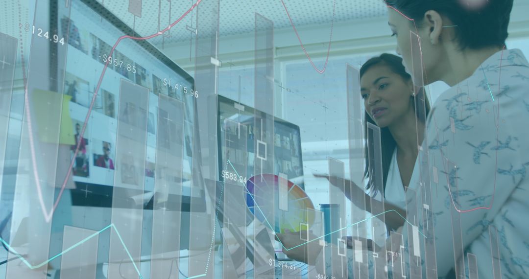 Fashion Designers Collaborating on Computer with Digital Graphs Overlay