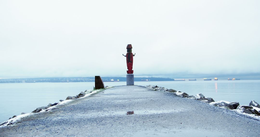 Winter Scene with Coastal Statue on Jetty - Free Images, Stock Photos and Pictures on Pikwizard.com