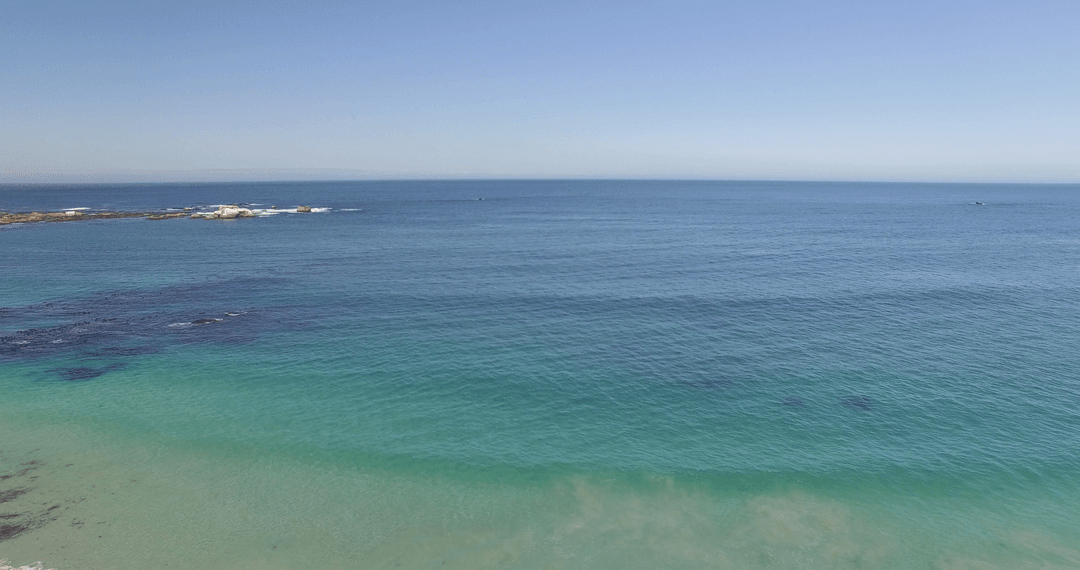 Transparent Waters Over Crystal Clear Beachfront Ocean