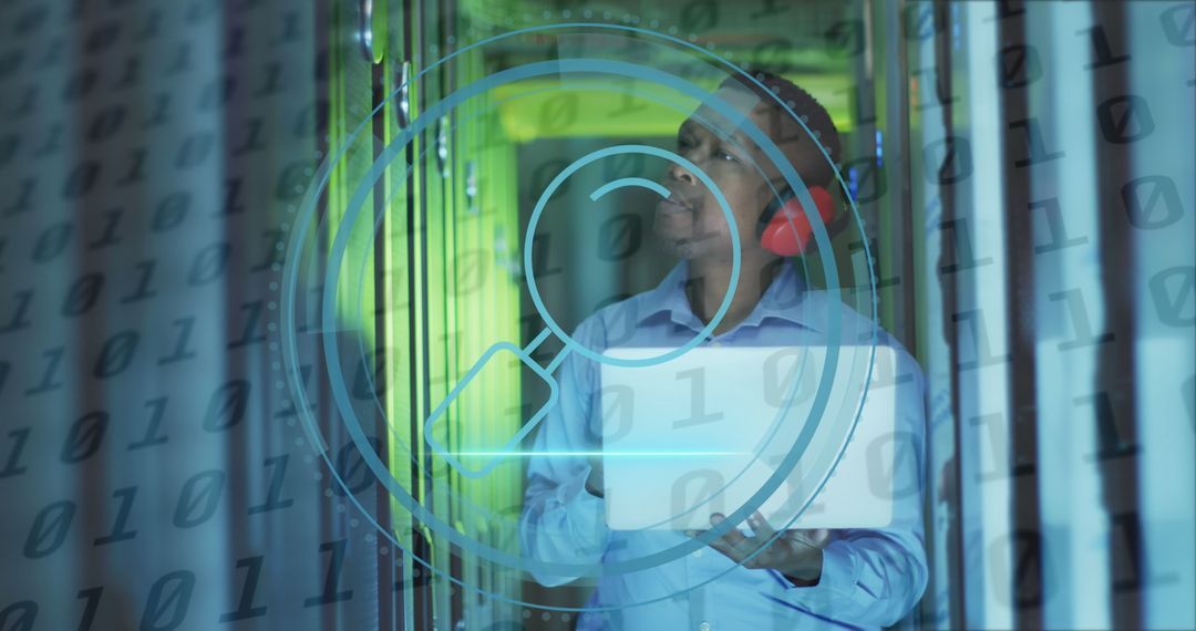 African American IT Technician Analyzing Data in Server Room