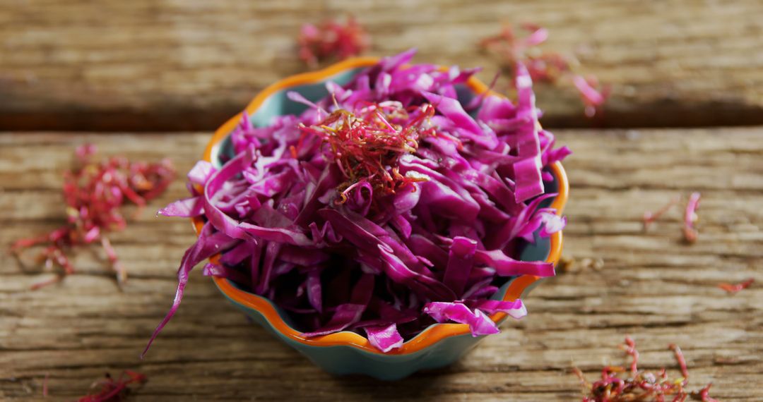 Fresh Shredded Red Cabbage in Blue Bowl on Wooden Table - Free Images, Stock Photos and Pictures on Pikwizard.com