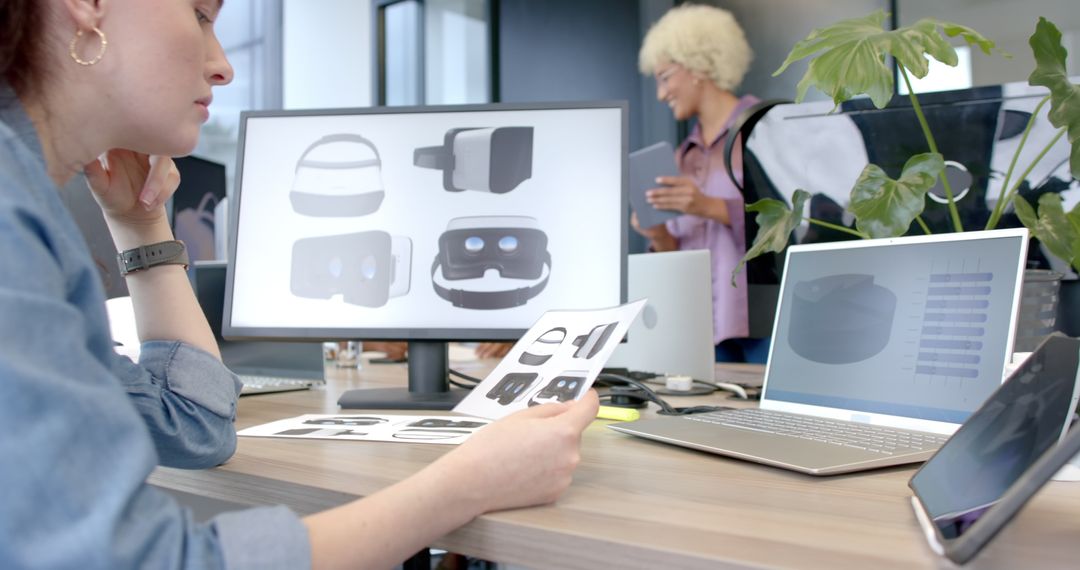 Designers Developing Innovative VR Headsets in Modern Office