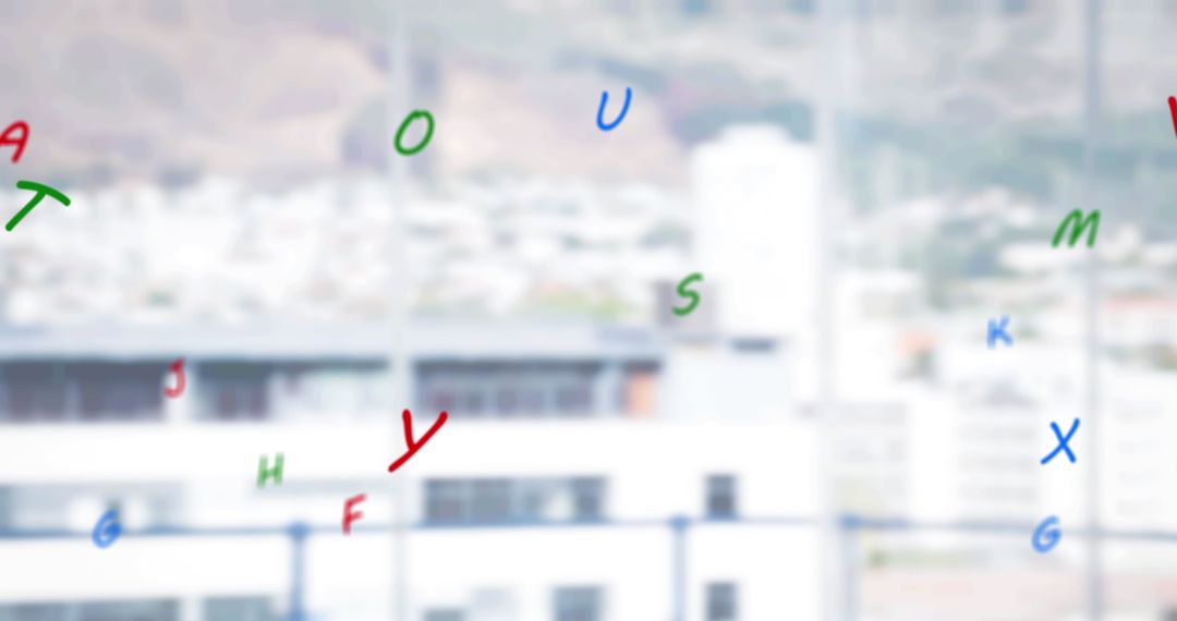 Colorful Alphabet Letters Falling Over Cityscape Background