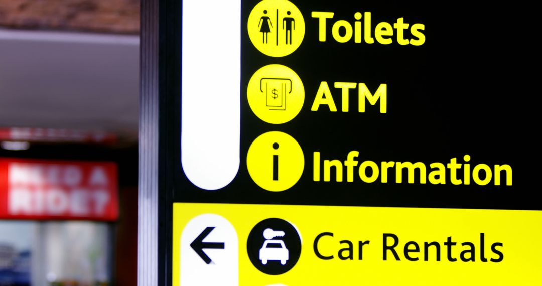 Directional Signs for Passengers in Airport Terminal