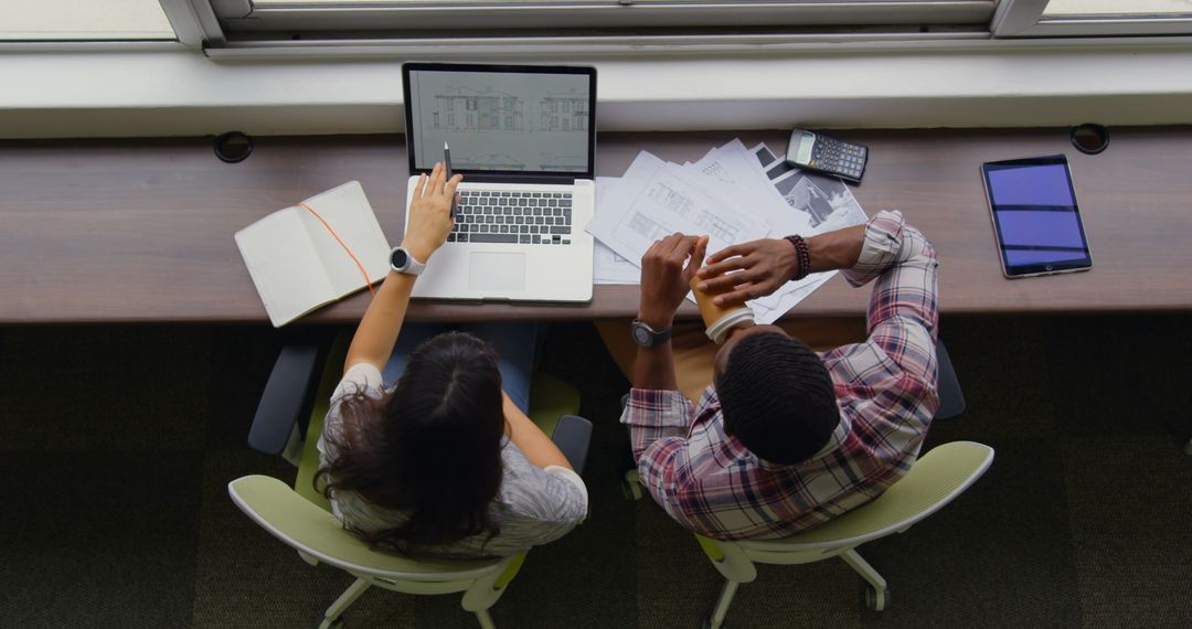 High Angle View of Diverse Professionals Collaborating at Workspace