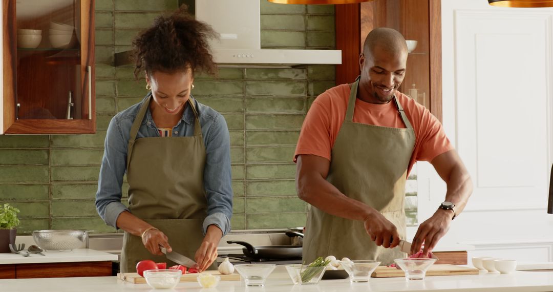 Smiling Couple Enjoys Cooking in Stylish Kitchen